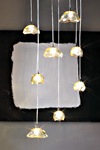 Suspension huit globes aplatis en verre ambre Ninfea. Vistosi. Suspension huit globes aplatis en verre ambre Ninfea. Vistosi.
