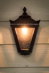 Small outdoor wall light in black cast iron Traditional. HARTE. 