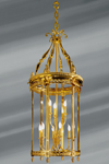 Lanterne de style Louis XVI en bronze massif et verre bombé, neuf lumières sur deux étages. Lucien Gau. 