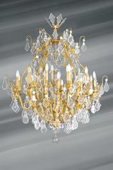Lustre doré en cristal de bohème Louis XVI forme cage trente lumières. Lucien Gau. 