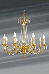 Lustre Louis XVI doré cristal de bohème en perles huit lumières. Lucien Gau. 