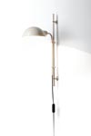 Funiculi white industrial-style metal wall light with 360° adjustable reflector. Marset. 