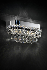 Chromed metal and crystal pendants wall lamp . Masiero. Chromed metal and crystal pendants wall lamp . Masiero.