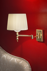 Golden articulated wall light. Masiero. 