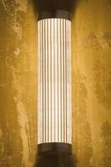 Polished bronze cylindrical and fluted glass wall light. Nautic by Tekna. Polished bronze cylindrical and fluted glass wall light. Nautic by Tekna.