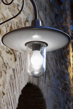 Large outdoor wall lamp with curved arm in patinated brass