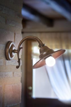 Wall lamp on bracket in aged brass and aged copper M. Lescaut - Wall lights by Aldo Bernardi