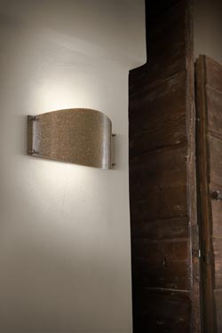 Oval wall lamp in aged patinated brass