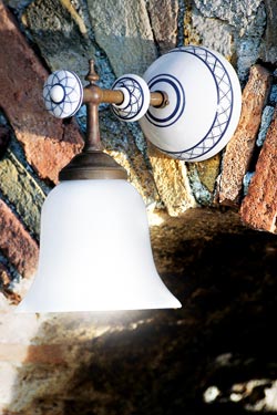 Simple wall lamp with patinated brass rod, decorated white porcelain and smooth opal glass - Wall lights by Aldo Bernardi