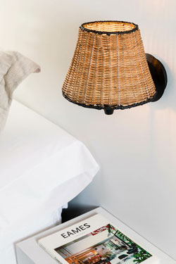Sumba bedside wall lamp in natural rattan