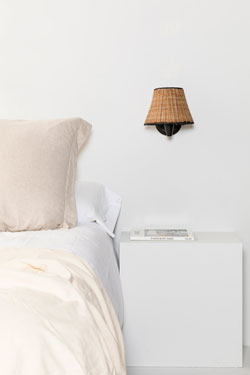 Sumba bedside wall lamp in natural rattan