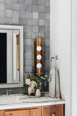 Hopper gold sconce with three opal glass balls