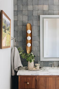 Hopper gold sconce with three opal glass balls